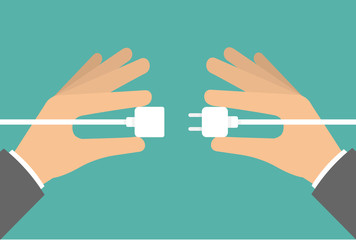 Two hands connecting or unplugging power cable - obrazy, fototapety, plakaty