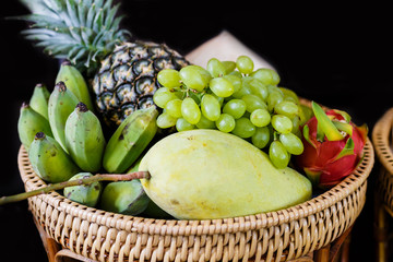 Set of fresh tropical fruits including grape  banana pineapple  mango coconut