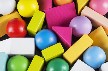 Abstract Background. Background with different colorful shapes wooden blocks. Geometric shapes in...