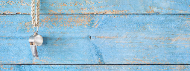 whistle of a soccer / football referee / trainer, grungy background, free copy space