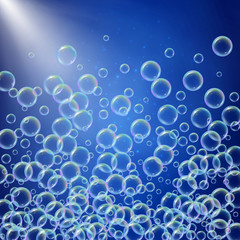 Shampoo foam in floating with realistic water bubbles on blue background with sunshine flare. Cleaning liquid soap foam for bath and shower. Shampoo rainbow bubbles. Swimming pool flyer and invite.