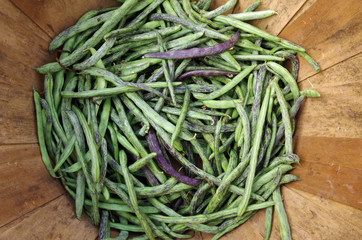 Dragon tongue beans in wooden basket viewed from above