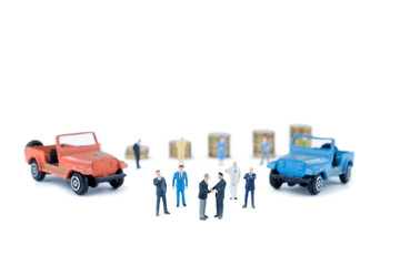 Fototapeta premium Miniature business people with car dealer in cars exhibition show
