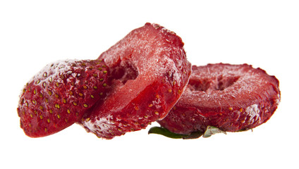 Frozen strawberries isolated on white background close-up