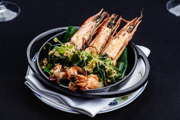 Royal prawns served with herbs and quinoa.