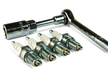 Spark Plug  and  wrench  on white background