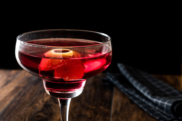 Boulevardier cocktail with lemon peel.