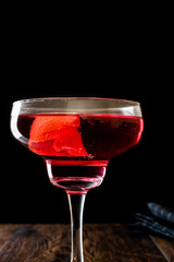 Boulevardier cocktail with lemon peel.