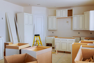 Custom kitchen cabinets in various stages of installation