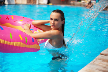 Beautiful woman in a swimming pool