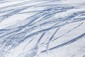 Fototapeta na wymiar Traces of skis on snow as background