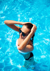 Beautiful model in a swimming pool
