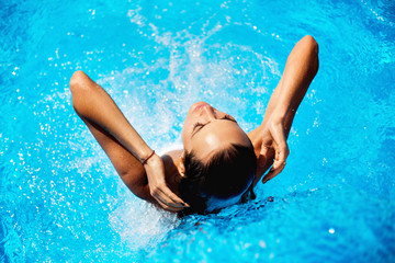 Beautiful woman in a swimming pool