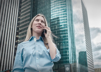 Businesswoman. Happiness businessman with phone around skyscrape