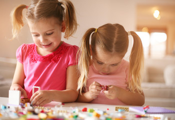 Fototapeta premium Girls playing at home.