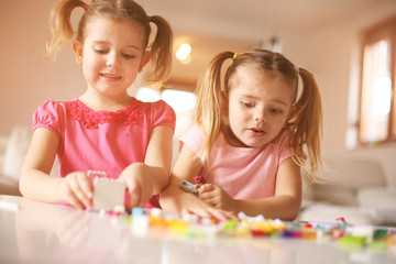 Fototapeta premium Girls playing at home.