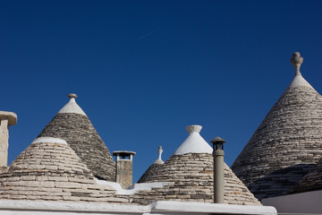 Fototapeta na wymiar Unique Trulli houses with conical roofs in Alberobello. Puglia, Italy