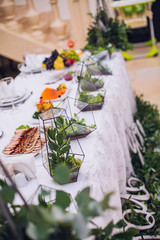 Catering in restaurant. Wedding banquet. Wedding party. Restaurant event. Banquet, wedding, catering, celebration. Wedding restaurant. Served tables. Decor in green and white colors.