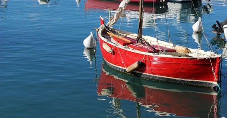italy: Red boat in Lerici sea.