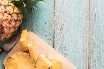 pineapple on the wood texture background..