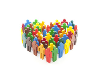 Group of colorful painted people figures in the shape of a heart