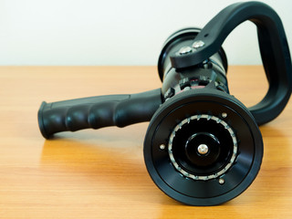 fire hose nozzle on the table. in Fireman's office.