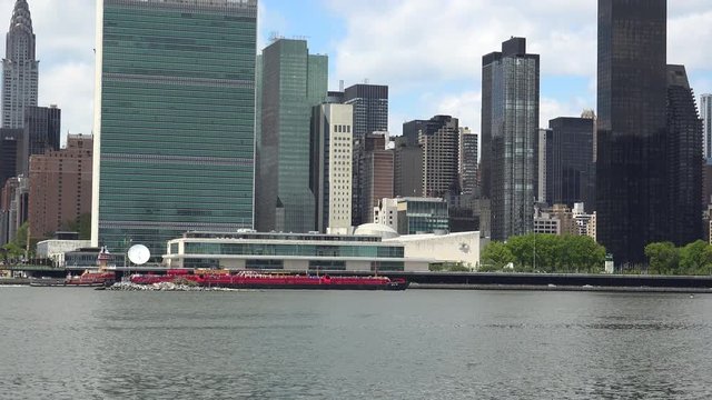 Viewing beautiful breathtaking Manhattan Skyline from Long Island City in New York, wide shot panorama with ONU,United Nations Headquarters,Ultra Hd 4k, real time