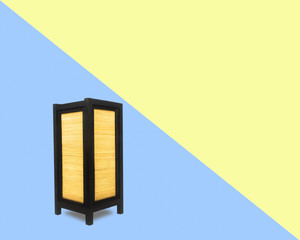 lantern on cross blue and yellow background,minimal concept