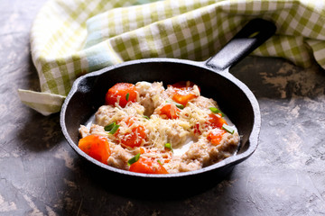 Homemade gnocchi with tomato sauce in frying pan