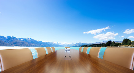 conference table with blue lake and blue sky