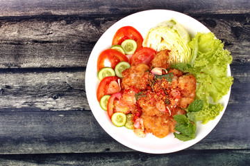 Spicy crispy deep-fried chicken salad.