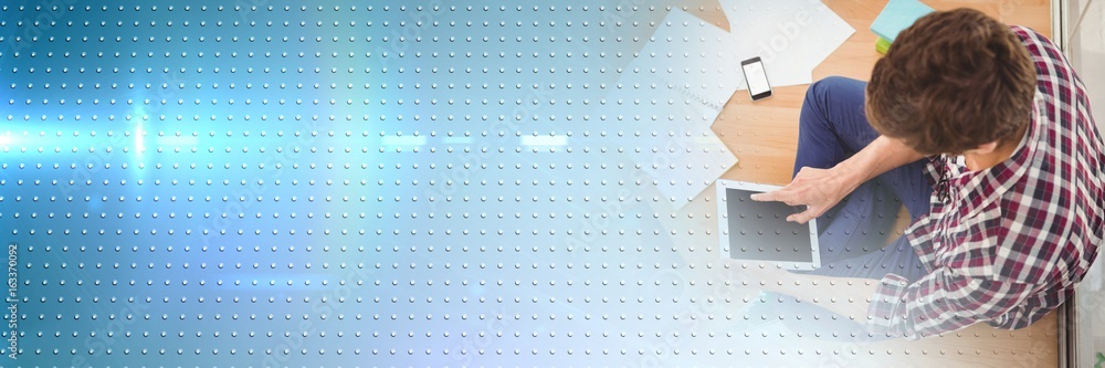 Poster overhead of man with tablet and blue smart tech transition