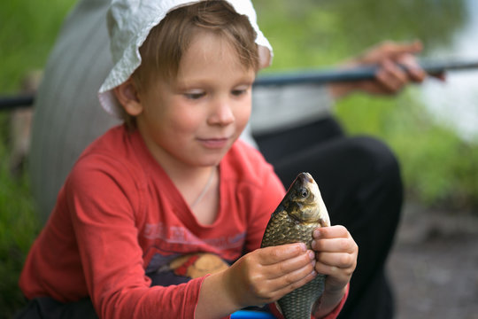 Caught A Small Fish In Children's Palms.