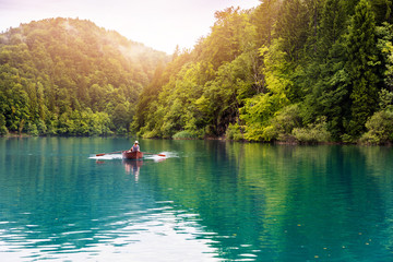 Fototapeta na wymiar ride in a rowboat in Plitvice national lakes park