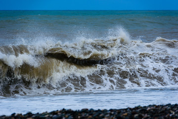 Fabulous stormy sea waves breaking near the coast