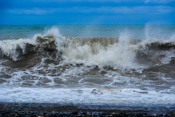 Fabulous stormy sea waves breaking near the coast