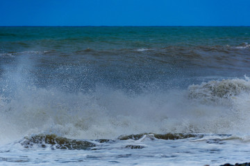 Fabulous stormy sea waves breaking near the coast