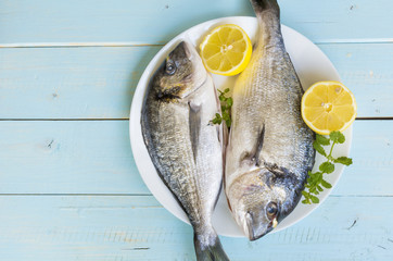 Fresh raw fish with lemon slices