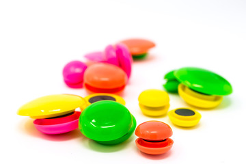 colored round magnets isolated on white background