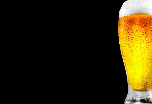 Beer. Glass Of Cold Beer With Water Drops. Craft Beer Isolated On Black Background