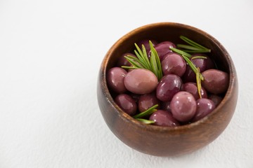 Pickled olives in wooden bowl