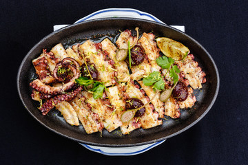 Fried octopus on a brazier