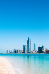 Beach and the city of Abu Dhabi