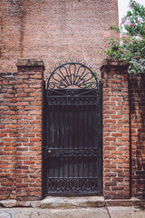 Forged iron gates. Entrance to the mysterious mansion in New Orleans