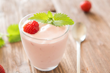Fresh strawberry yoghurt on rustic wooden table - 163375465