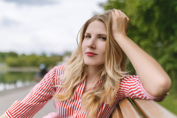 Outdoors portrait of beautiful young woman. Selective focus.