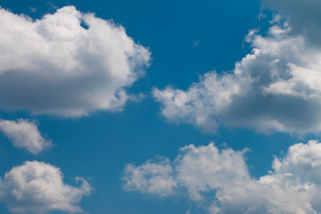 White clouds on a blue sky. The blue sky