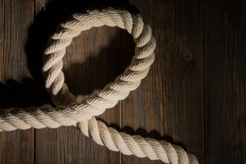 Obraz premium Sea rope on a wooden background.