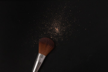 A buffing brush has flicked and some powder are spread