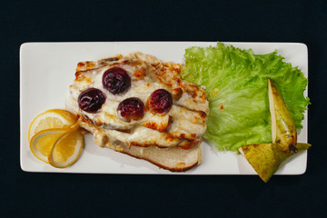 Grilled pork meat and vegetables on plate